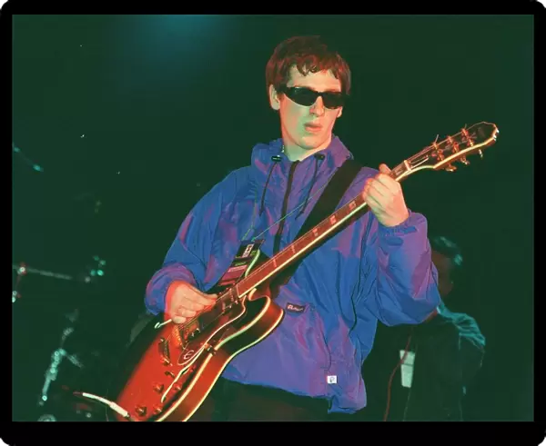 Guitarist with pop group Nowaysis Oasis tribute band at T in the Park on stage in NME