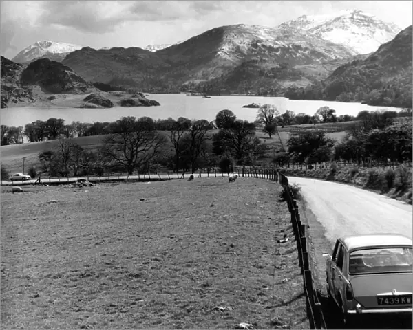 Lake District - A car travels along at Ullswater looking towards Patterdale 1 May 1967