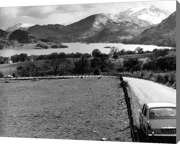 Lake District - A car travels along at Ullswater looking towards Patterdale 1 May 1967