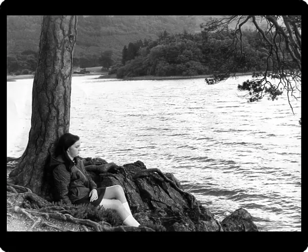 Lake District - Derwentwater - Friars Crag - A youngster sits by a tree