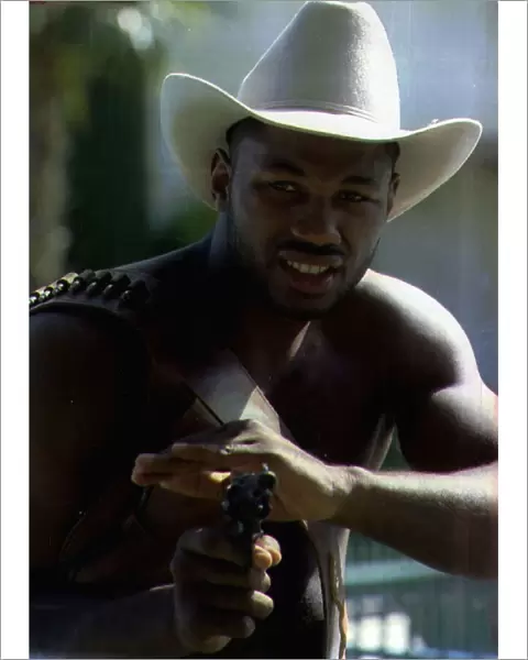 Lennox Lewis Boxing posing as a Cowboy in a press conference ahead of h WBC Heavyweight