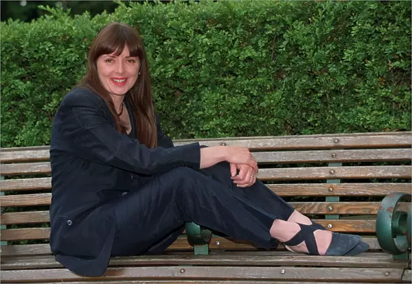 Carol Vorderman TV Presenter June 1997 Sitting on park bench