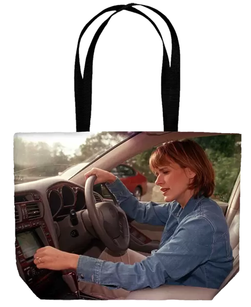 Carol Smillie tries out the computer navigation system in her Lexus car October 1998