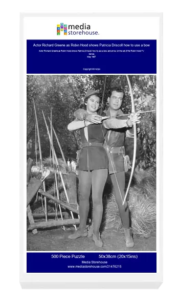 Actor Richard Greene as Robin Hood shows Patricia Driscoll how to use a bow