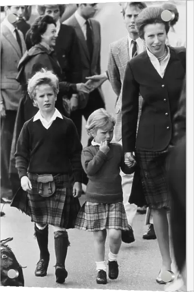 Princess Anne walking hand in hand with her two children Peter