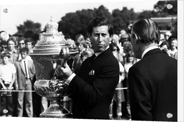 Prince Charles lifts up the Kings Coronation Cup July 1980