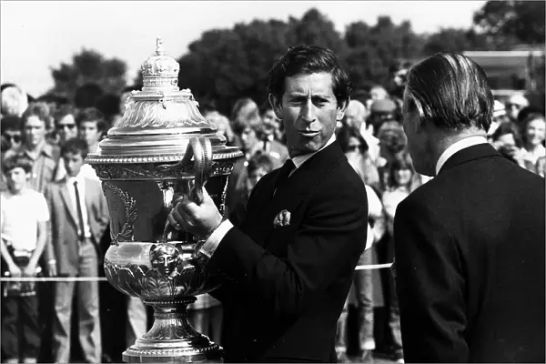 Prince Charles lifts up the Kings Coronation Cup July 1980