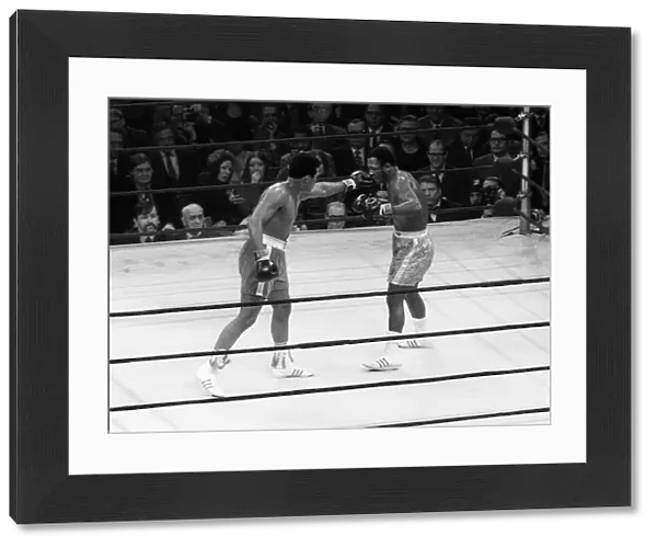 Action during the heavyweight World title fight between champion Joe Frazier