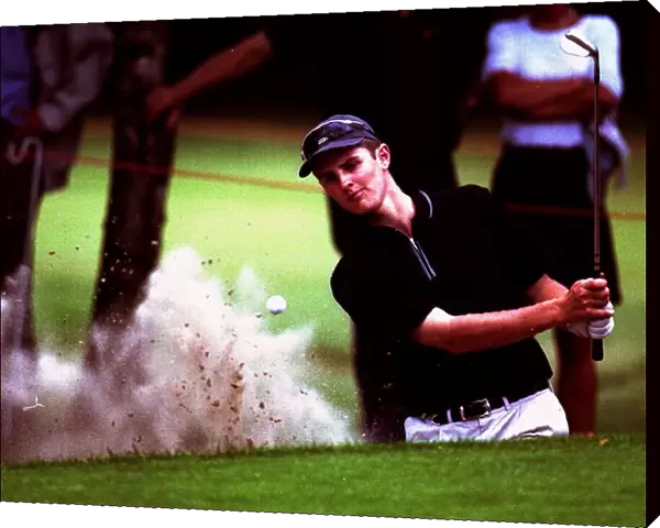 Justin Rose plays out of a greenside bunker on the 15th hole during the Dutch Open Golf