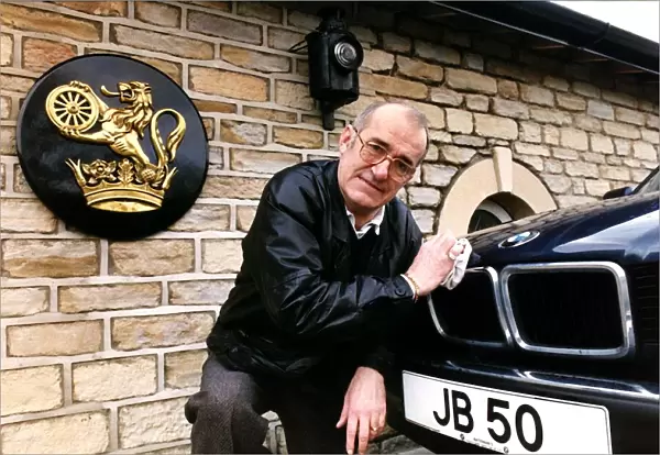 Jim Bowen Comedian  /  TV Presenter polishing his BMW car