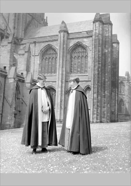 Two choristers stand in the grounds of Lichfield Cathedral. September 1959