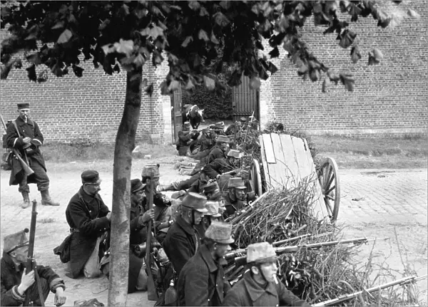 World War One - Belgian troops take up positions behind a barricade waiting for German