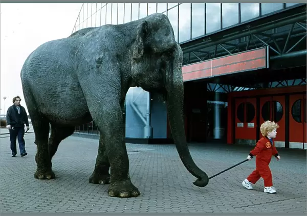Elephant small child takes elephant Janey for a walk at SECC circa 1989