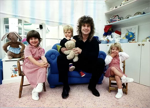 Ozzy Osbourne rock singer from the rock group Black Sabbath with his family May