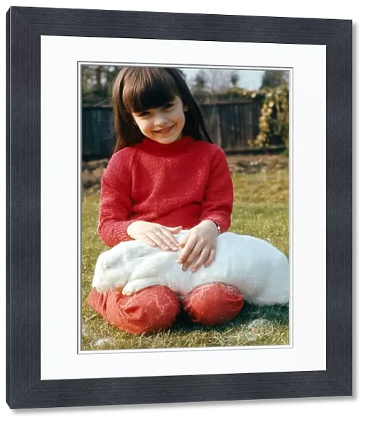 Girl with rabbit on her lap February 1989