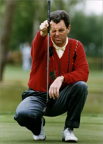 Bernard Gallacher Golf lining up a putt on the green