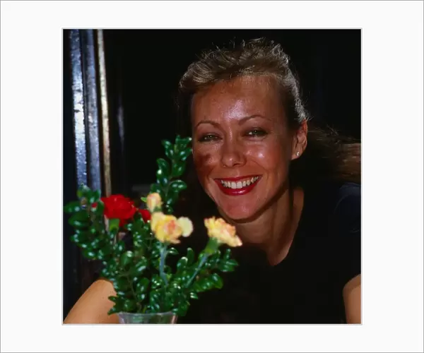 Jenny Agutter sitting at table March 1990