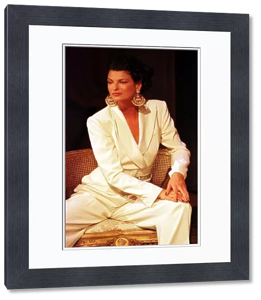 Linda Evangelista at Paris Fashion Week 1997 models a stunning cream trouser suit with