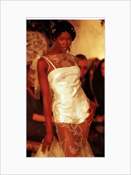 Naomi Campbell in John Galliano Show Paris Fashion 1997 wearing a short white dress with