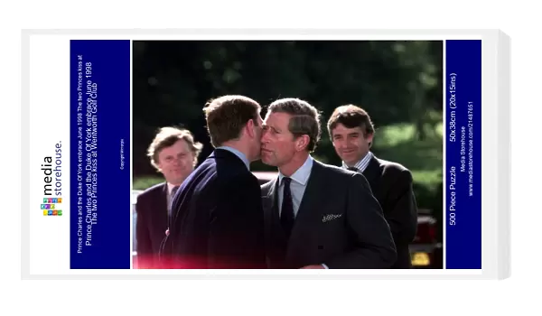 Prince Charles and the Duke Of York embrace June 1998 The two Princes kiss at