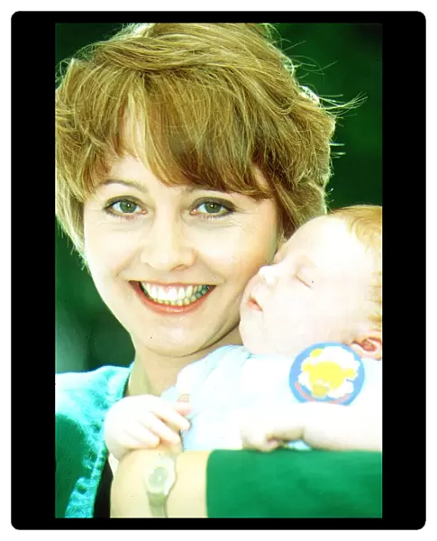 Anne Diamond TV Presenter holding Baby Michael O Conner Launching National Cot Death