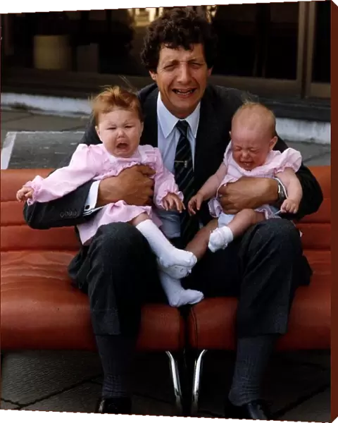 Chris Serle TV Presenter with two babies