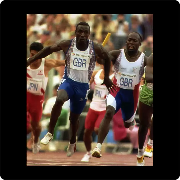 Linford Christie athlete carries baton in a relay