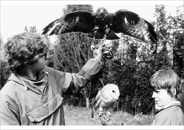 Fabian and Oliver Smith with their birds 1985 Buzzard and Barn Owl