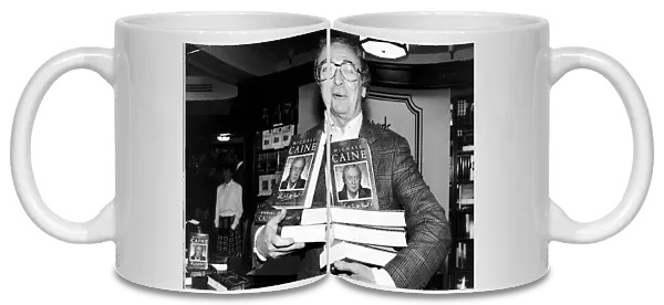 Michael Caine Actor with copies of his autobiography Whats It All About