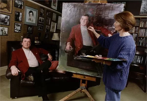 Terry Wogan TV Presenter sits patiently while artist June Mendozo paints his portrait
