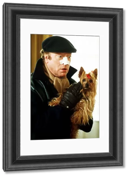 Michael Caine Film Actor in the new film Bullseye with his dog Ocotber 1989