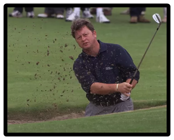 Ian Woosnam plays out of a bunker on his practice round on the eve of the 128th Open Golf