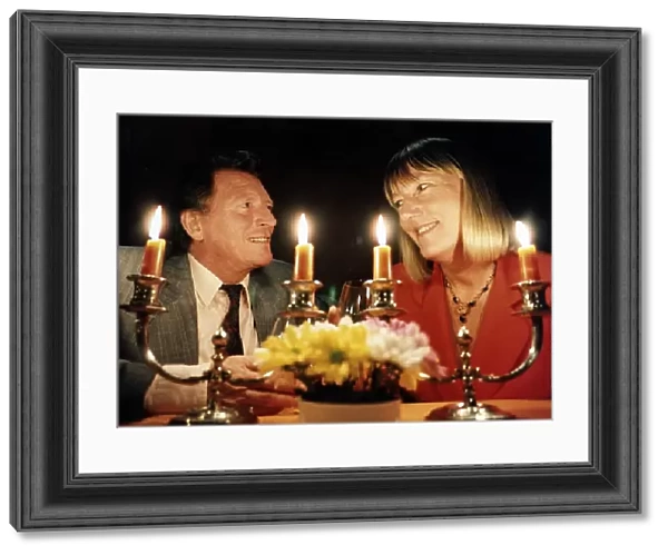 Johnny Briggs Actor with Hilary Bonner Daily Mirror Journalist dining by candlelight at