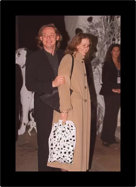 Martin Clunnes actor with unknown lady at the film premiere of 101 Dalmatians