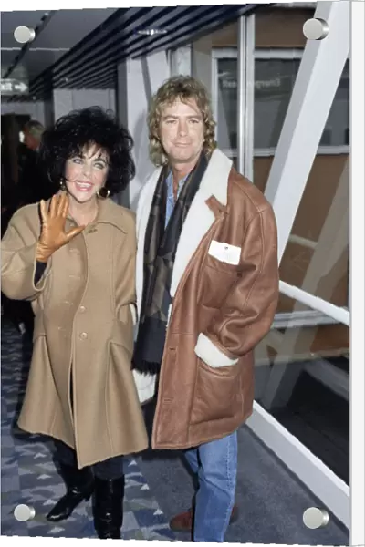 Elizabeth Taylor actress with her husband Larry Fortensky arriving at Heathrow airport