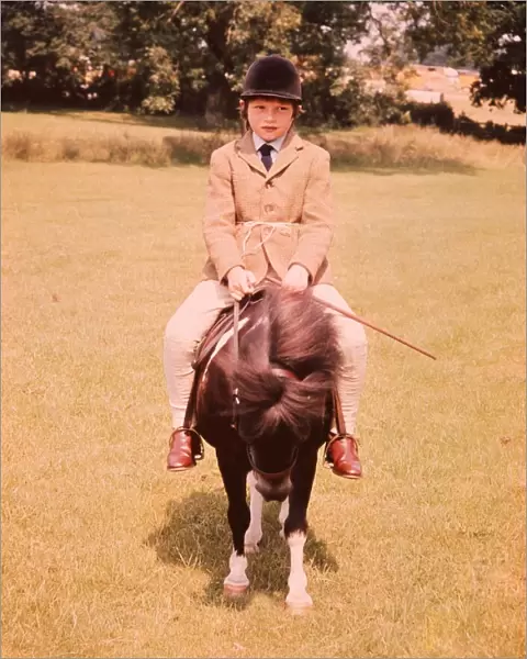 Moorland and Mountain Pony class at hiockstead. A young child riding on top of the pony