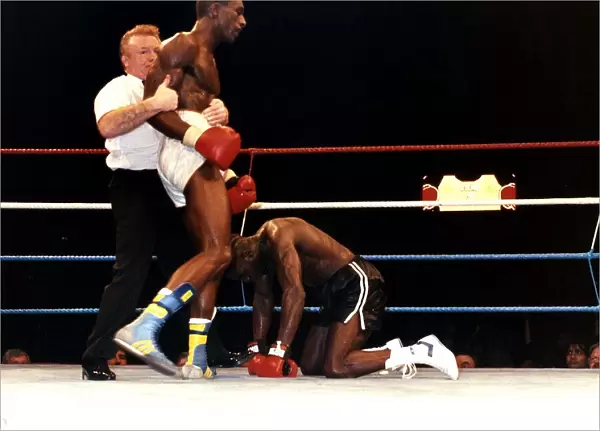 Rod Douglas is knocked down during a fight against Errol Graham at Wembley in 1989