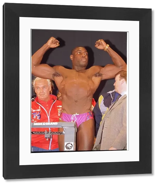 Frank Bruno flexes his muscles at the weigh in. Ready for the fight against Mike Tyson in