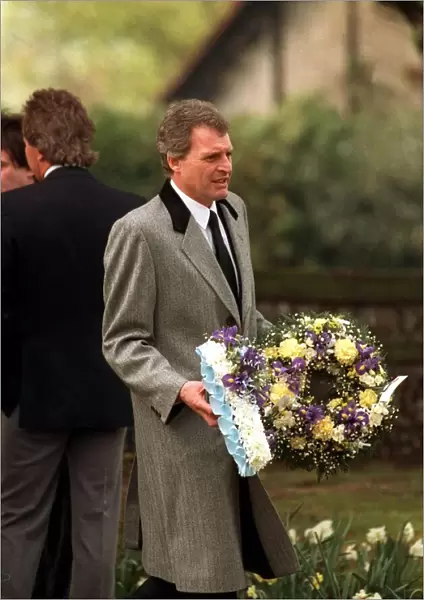 Peter Dean Actor carrying a wreath at the funeal of Mark Reid the son of Comedian Actor
