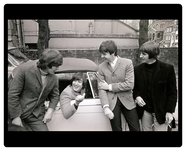 The Beatles by John Lennons car after he passed his L-test 15th february 1965
