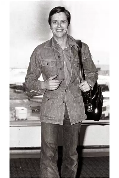 Ian Ogilvy Actor - June 1976. at the airport denim