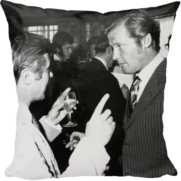 British actor Roger Moore July 1970 chatting with Bryan Forbes Associated
