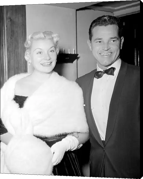 American Film Actress Barbara Payton wearing fur stole and muff at the Premiere of Film