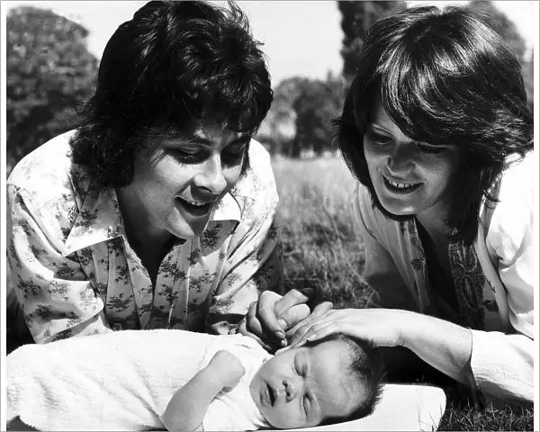 British actor Richard Beckinsale with Judy Lowe and their newborn baby daughter Kate