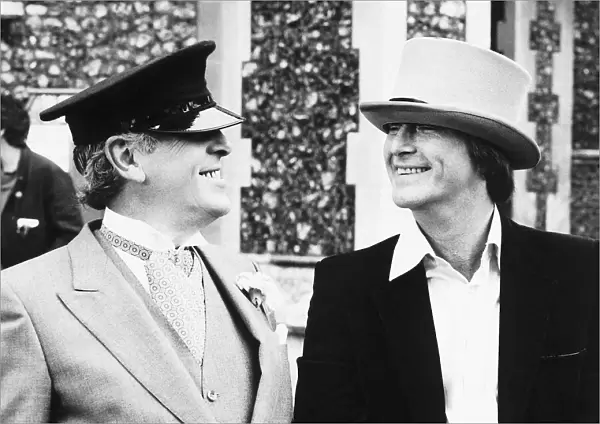 Dennis Waterman actor and George Cole actor relax during a break in filming episode