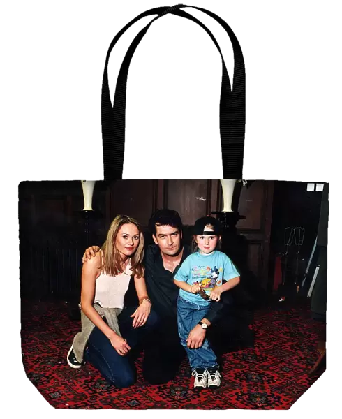 Charlie Sheen with Leandra Strand and daughter Tyla in August 1997