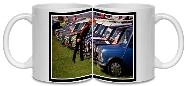 Mini car August 1999 Woman looking at blue Minis Mini cars are at Silverston for 40th