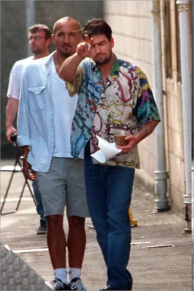Charlie Sheen actor filming July 1997, at Clydebank Town Hall near Glasgow with cup of
