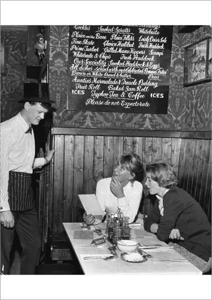 Waiter John Hughes serving customers at the Contented Sole