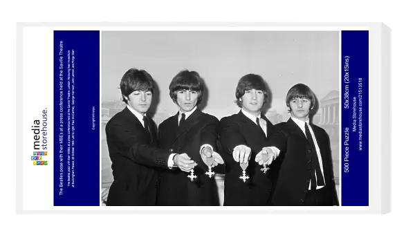The Beatles pose with their MBEs at a press conference held at the Saville Theatre